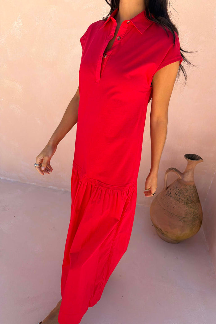 Red Darcy Dress in bright red cotton with a collared neckline, cap sleeves and a dropped waist.