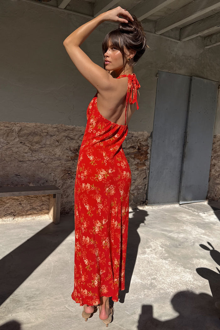 Red Floral Halter Dress featuring a vintage floral print, tie-neck fastening, and open back.