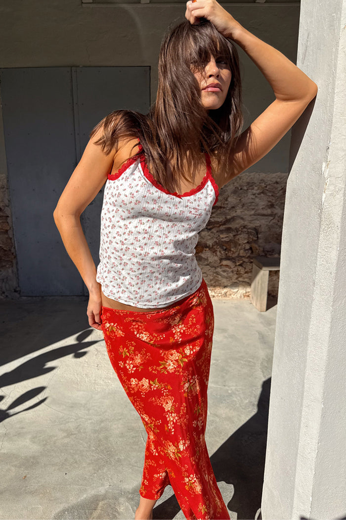 Red Floral Midi Skirt in a white floral print, paired with a coordinating lace-trim pointelle vest co-ord.