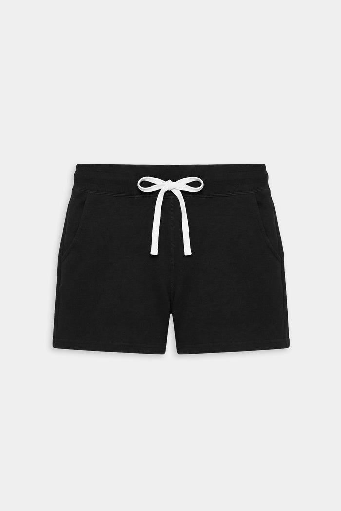 The SPLITS59 Reena Fleece Sweatshort in black features an elastic waistband, white drawstring, and side pockets, crafted from ultra luxe fleece—ideal for workouts. Shown on a plain white background.
