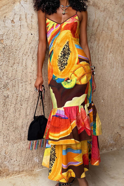 Rio Laragh Dress with a tropical papaya and citrus print, cotton-linen fabric, and a tiered hem midaxi silhouette.