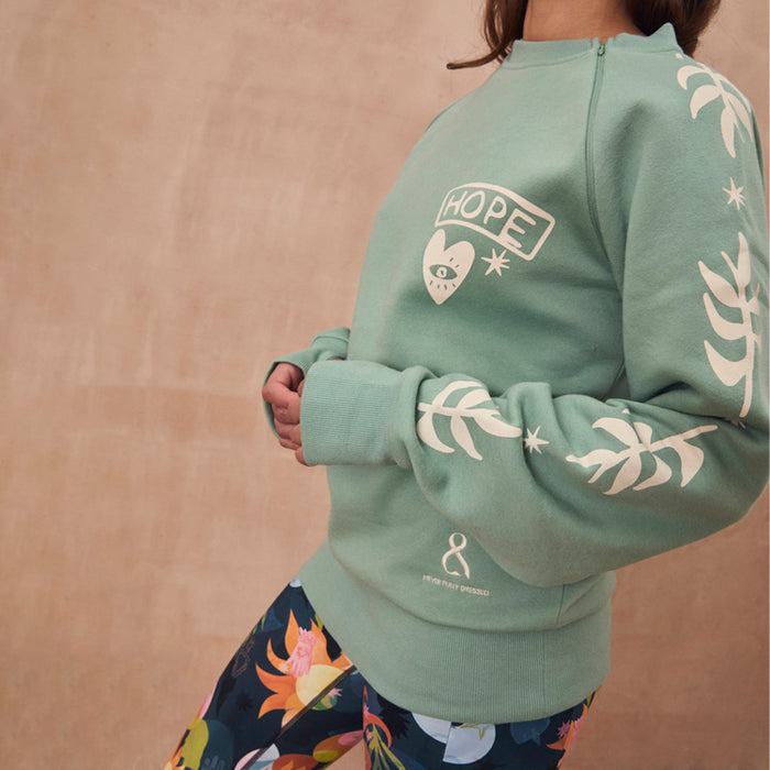 Sage green Sundazed sweatshirt with cream palm prints and a functional zip for medical treatment access.