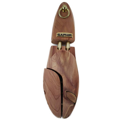 A pair of red aromatic cedar wood shoe trees with brass fittings, designed to be inserted into shoes to maintain their shape.