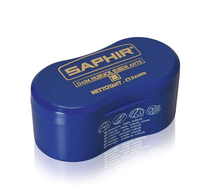 A blue sponge with a black brush designed for cleaning suede and nubuck, branded with the name 'SAPHIR'.