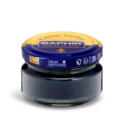 A jar of Saphir Creme Surfine shoe polish with a label on the lid.