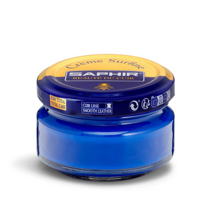 A jar of Saphir Creme Surfine shoe polish with a label on the lid.