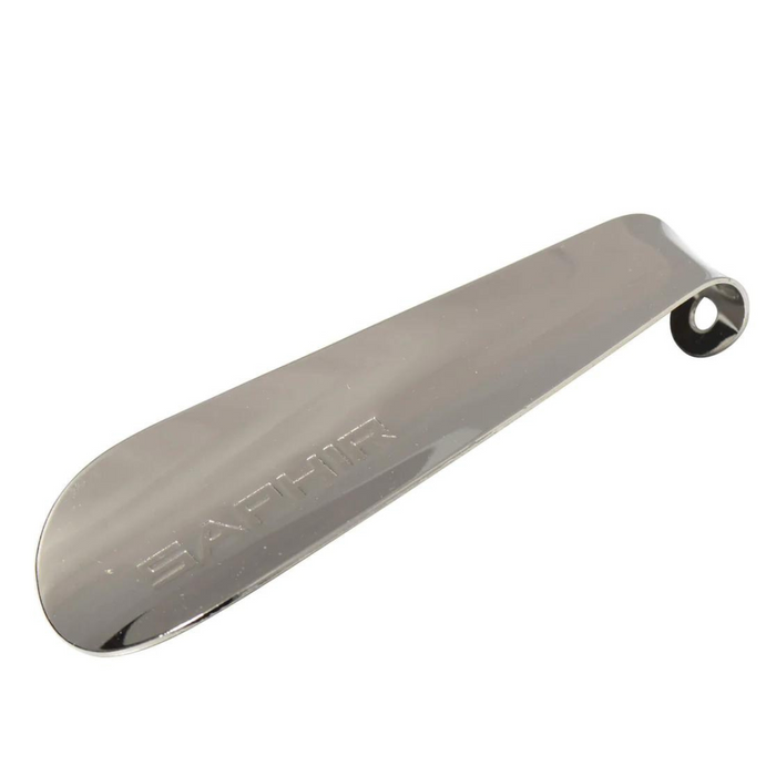A silver metal shoehorn with the brand name 'SAPHIR' embossed on it.