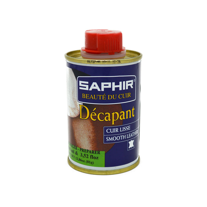 A can of Saphir Decapant Leather Stripper with a red cap on a white background.