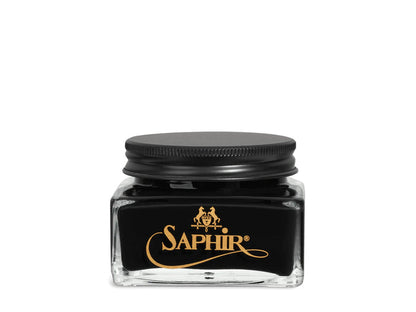 A glass jar with a black lid labeled 'SAPHIR' containing cream shoe polish.