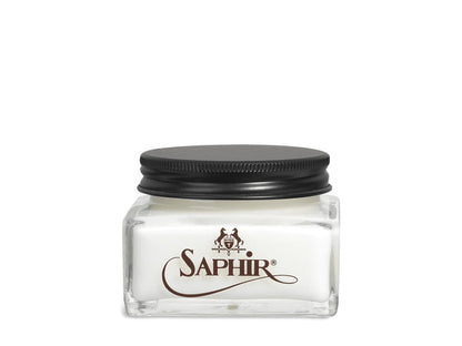 A glass jar with a black lid labeled 'SAPHIR' containing cream shoe polish.