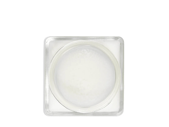 A glass jar 'SAPHIR' containing cream shoe polish.