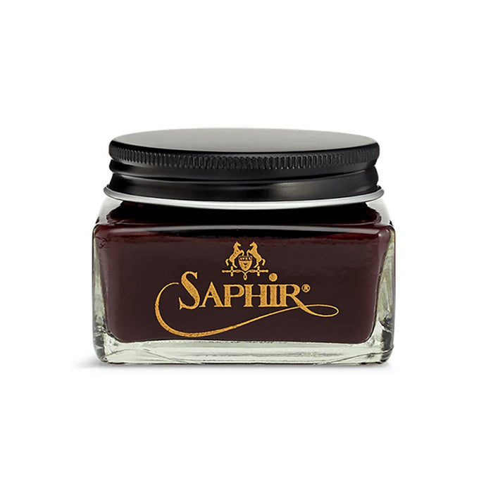 A glass jar with a black lid containing brown-colored Saphir Medaille D'Or Cordovan Cream Shoe Polish, branded with the Saphir logo on the front.
