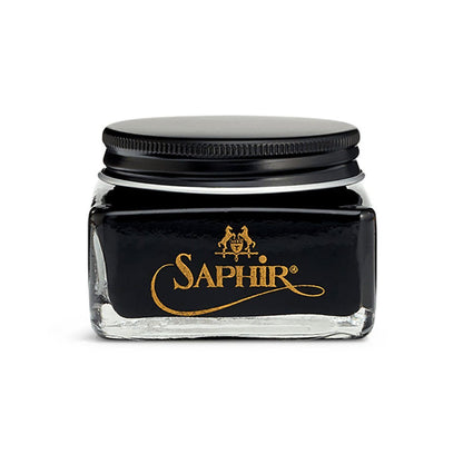 A glass jar with a black lid containing black-colored Saphir Medaille D'Or Cordovan Cream Shoe Polish, branded with the Saphir logo on the front.