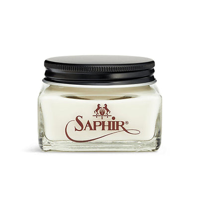 A glass jar with a black lid containing clear-colored Saphir Medaille D'Or Cordovan Cream Shoe Polish, branded with the Saphir logo on the front.