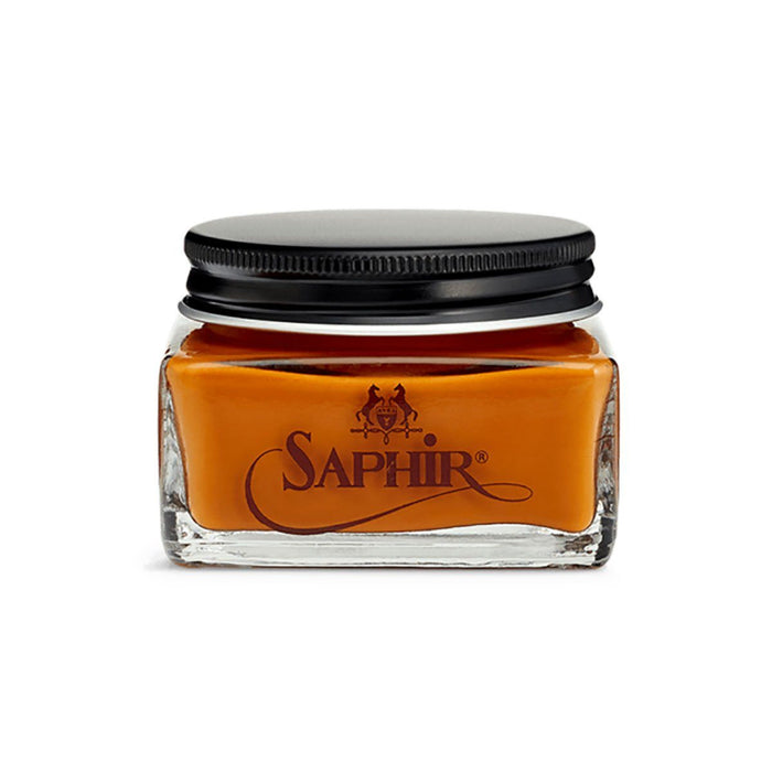 A glass jar with a black lid containing brown-colored Saphir Medaille D'Or Cordovan Cream Shoe Polish, branded with the Saphir logo on the front.