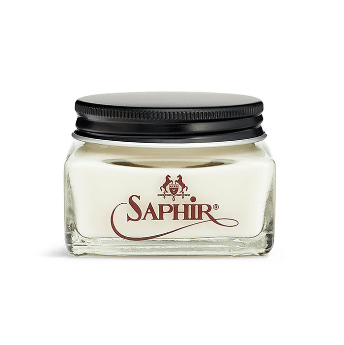 A jar of Saphir Medaille D'Or Nappa Leather Cream with a black lid on a white background.