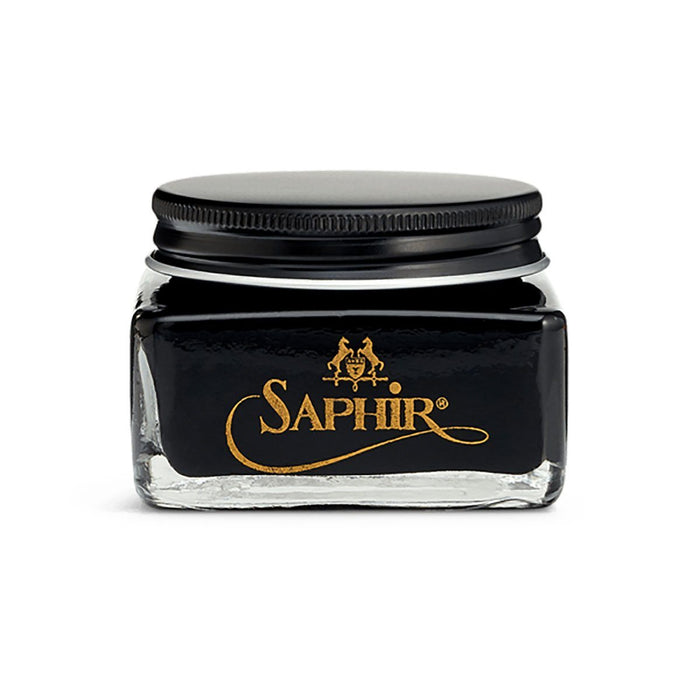 A glass jar with a black lid containing Saphir Medaille D'Or oiled leather cream, branded with the Saphir logo in gold lettering on a black label.