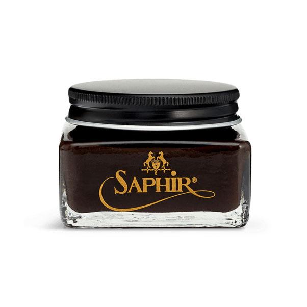 A glass jar with a black lid containing Saphir Medaille D'Or oiled leather cream, branded with the Saphir logo in gold lettering on a black label.