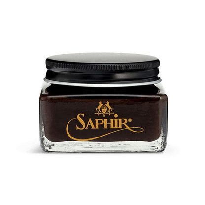 A glass jar with a black lid containing Saphir Medaille D'Or oiled leather cream, branded with the Saphir logo in gold lettering on a black label.