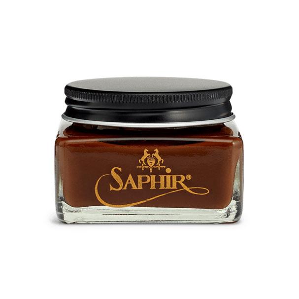 A glass jar with a black lid containing Saphir Medaille D'Or oiled leather cream, branded with the Saphir logo in gold lettering on a black label.
