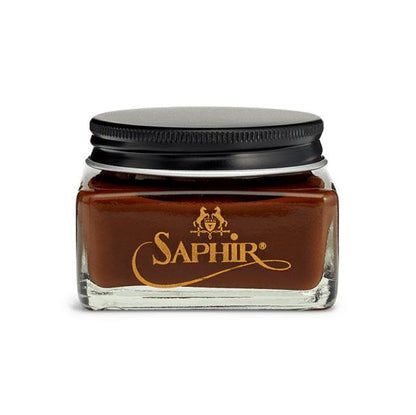 A glass jar with a black lid containing Saphir Medaille D'Or oiled leather cream, branded with the Saphir logo in gold lettering on a black label.