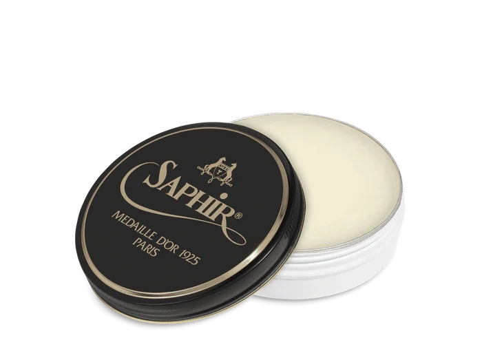 A round tin container of Saphir Medaille D'Or shoe wax polish with black lid and gold lettering.