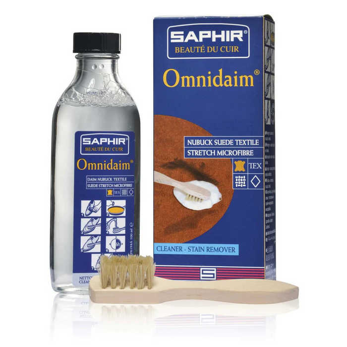 A product image featuring a bottle of Saphir Omnidaim Suede Multicleaner, a suede brush, and packaging box.