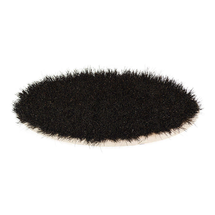 An oval shoe shine brush with horsehair bristles, with natural black bristles, wooden handle, on a white background.