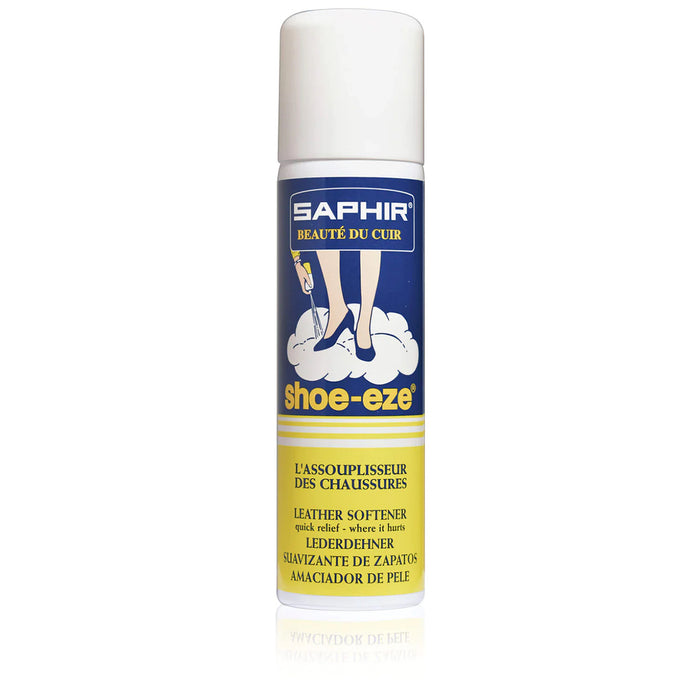 A white spray can of Saphir Shoe-Eze Leather Softener Spray with product information and branding on the label.