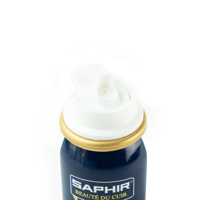 A white spray can of Saphir Shoe-Eze Leather Softener Spray with product information and branding on the label.