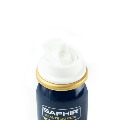A white spray can of Saphir Shoe-Eze Leather Softener Spray with product information and branding on the label.