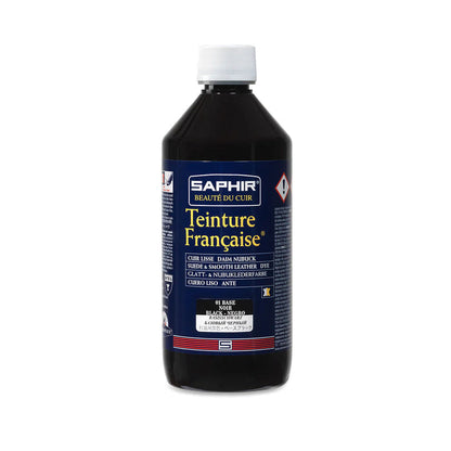 A product image featuring a box and bottle of Saphir Teinture Francaise dye for leather, with a color swatch and branding visible.