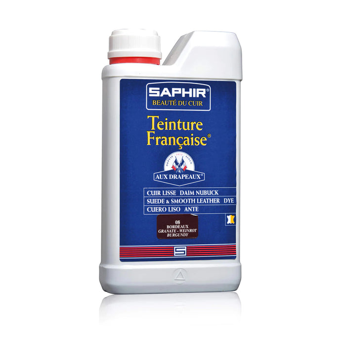 A product image featuring a box and bottle of Saphir Teinture Francaise dye for leather, with a color swatch and branding visible.