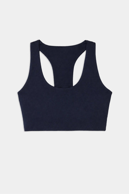 The SPLITS59 Sara Airweight Bra in Indigo is showcased on a white background—ideal for hot yoga or Pilates sessions.