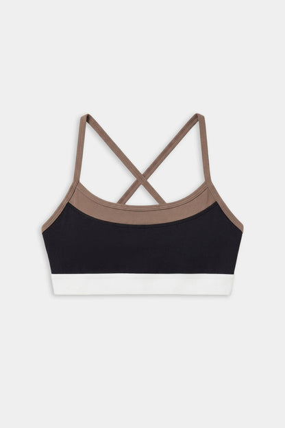 The SPLITS59 Scottie Airweight Bra - Black/Lentil features a color-blocked design with brown straps, a black front panel, and a white bottom band in soft nylon-spandex blend, shown on a white background.