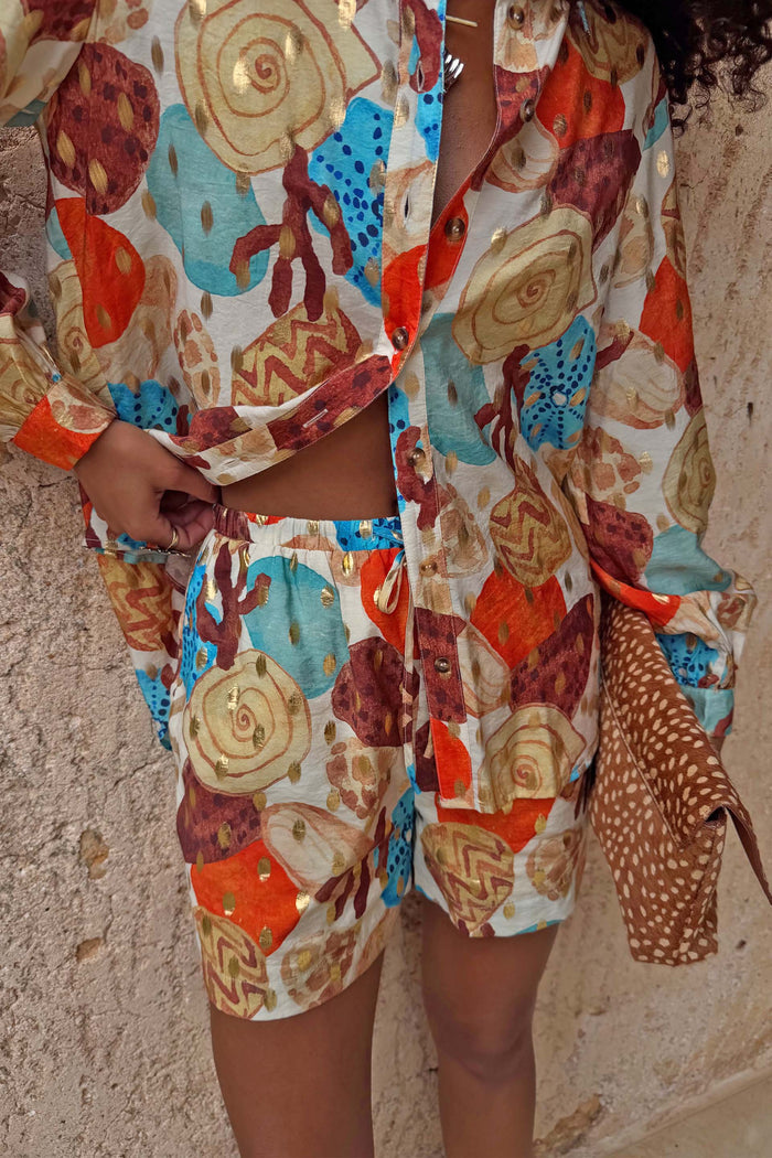 Shell Ellie Shorts in an abstract shell print with metallic detailing, styled as a summer co-ord.