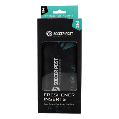 A retail package of Soccer Post Freshener Inserts. The vertical black box features a teal header with "2 PK" and a clear window showing a black fabric insert inside. The Soccer Post logo and tagline, "America's Soccer Store," are printed in white. Text at the bottom reads "FRESHENER INSERTS" and "Odor Control For Shoes And Gear" above icons representing athletic equipment.