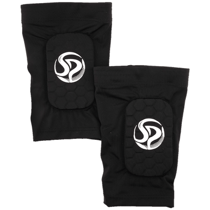 Two black protective athletic pads with a white "SP" logo and hexagonal padding, shown against a green background.