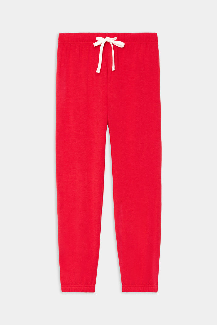 The SPLITS59 Sonja Fleece Sweatpant in Pirate Red features ultra-luxe fleece, an elastic waistband, white drawstring, and elastic cuffs, shown laid flat on a white background.