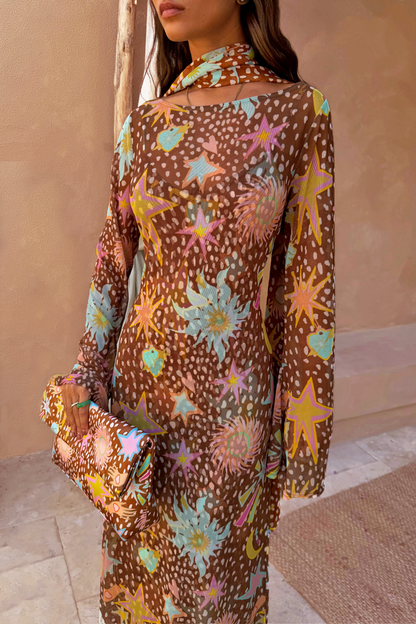 Star Fawn Aria Mesh Dress in brown sheer mesh with fawn spots and star print, paired with a matching clutch.