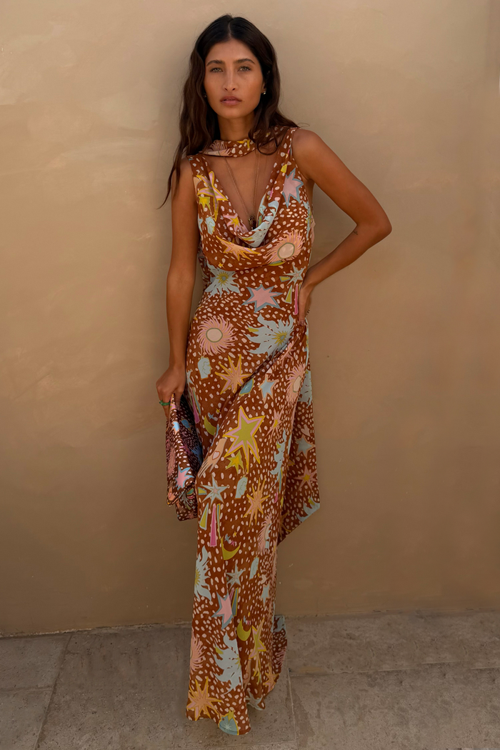Star Fawn Sophie Dress in brown with sun motifs, featuring a draped neck and matching detachable scarf.