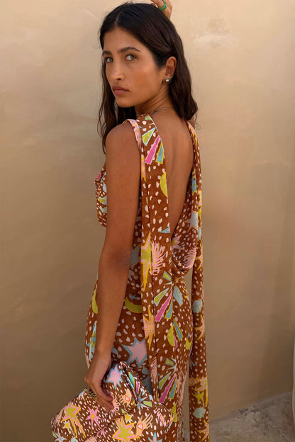 Star Fawn Sophie Dress in brown with a low back and detachable scarf detail, held with a matching clutch.