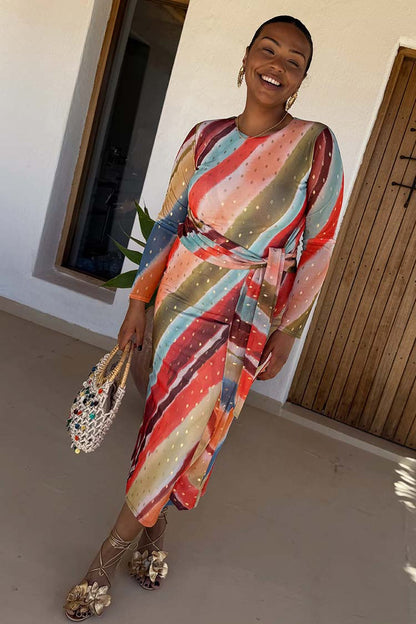 Sunset Stripe Mesh Midi Dress in multicoloured silky mesh with a cinched wrap tie waist on a model.