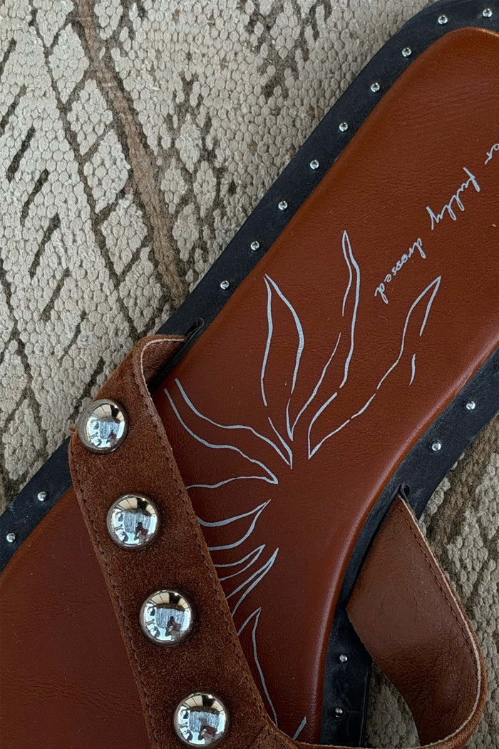 Tan Leather Stud Sandals featuring silver studs on suede straps and branded footbed artwork.