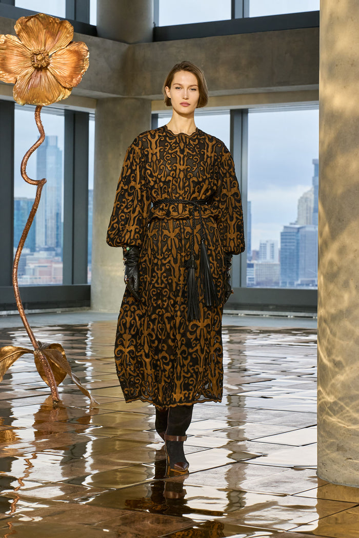 AW25 Runway Look - Model in Printed Dress with Black Tassel Belt | Ulla Johnson