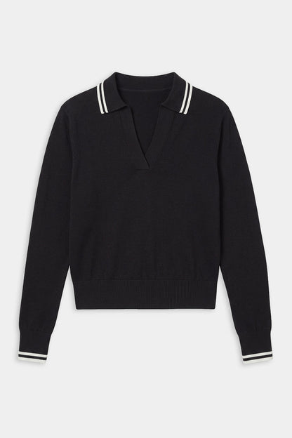 The SPLITS59 Taylor Knit Polo in Black/White is a soft rayon long-sleeve sweater with a V-neck and white double stripes on the collar and cuffs.