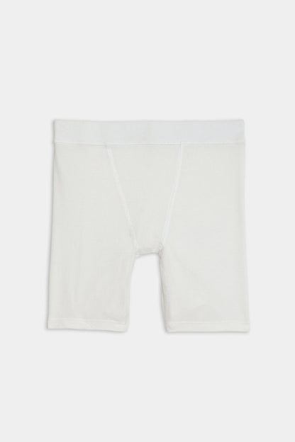 White, knee-length Theo Rib Short - White with a fitted design crafted from a blend of MODAL and SPANDEX fabric, featuring an elastic waistband, displayed against a plain background by SPLITS59.