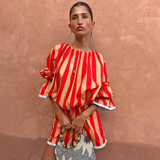 Red and camel Tomato Stripe Blouse with voluminous sleeves, styled as a co-ord with matching shorts.