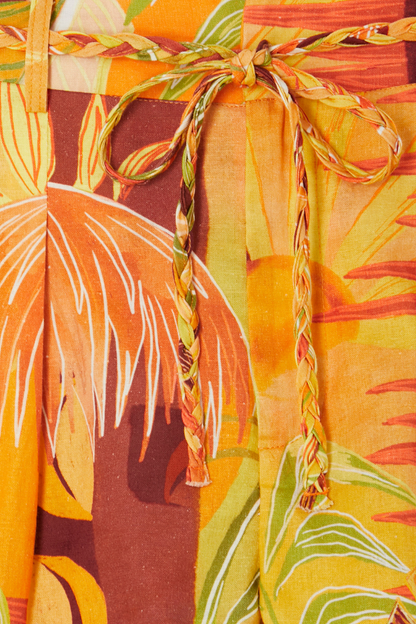 Verano Tate Shorts detail highlighting the tropical sun and palm print with a braided tie waist belt.