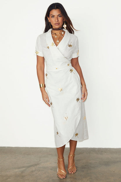 White cotton linen Brooklyn wrap dress with metallic gold palm flecks and a wraparound collar.